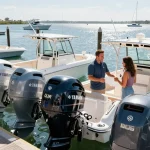Yamaha outboard motor for sale USA at a sunny marina with customer and representative.